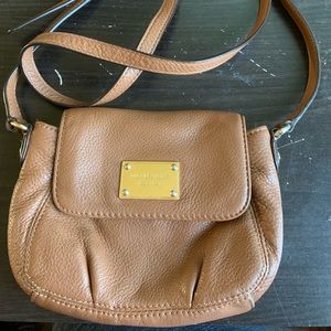 Small brown Michael Kors crossbody bag.